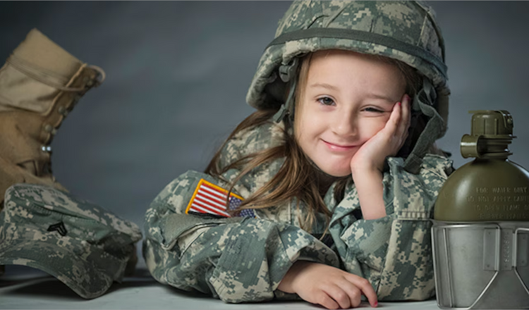 Adorable girl in military outfit showcasing girls camo clothing with gear and playful smile