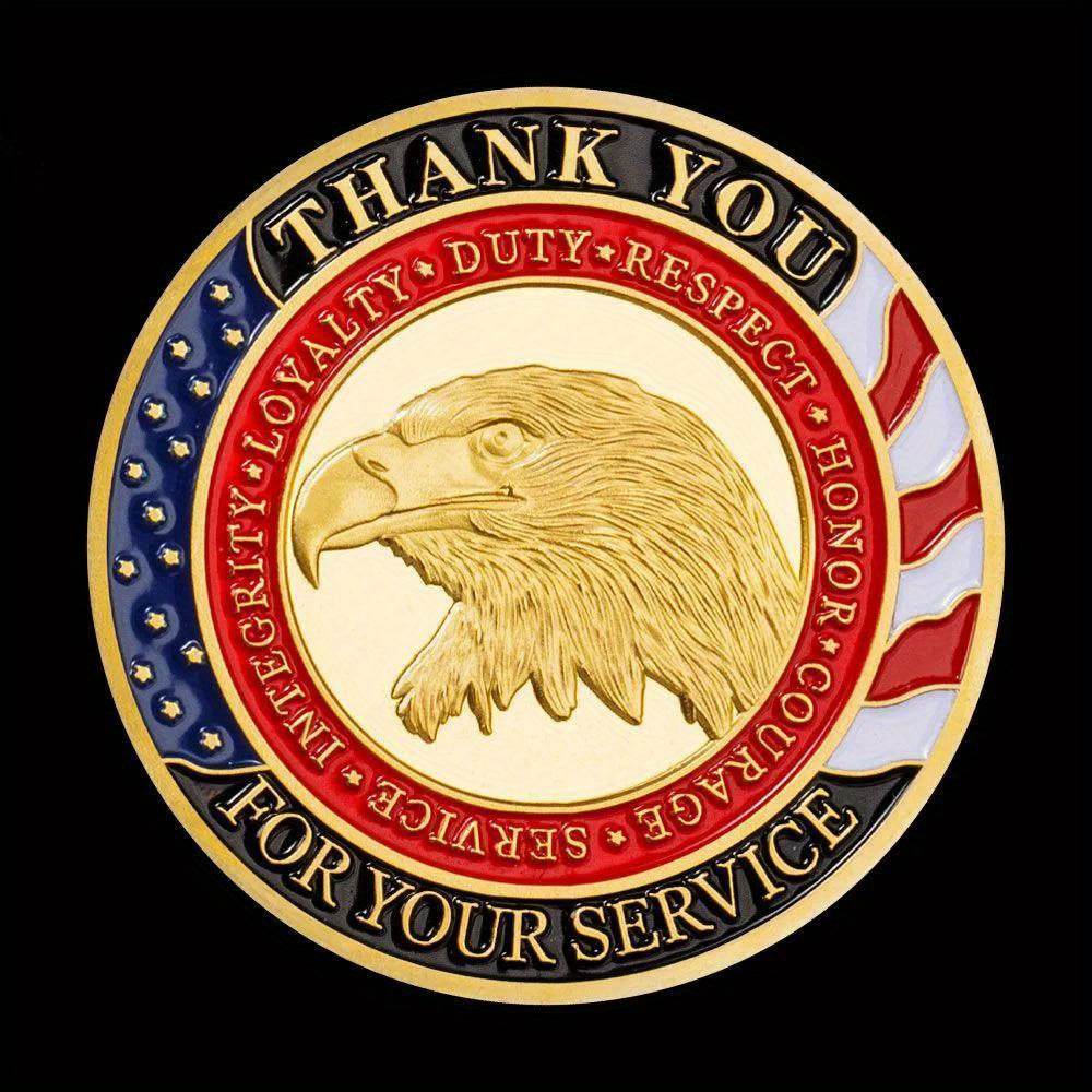 Gold commemorative coin featuring an eagle and patriotic text for honoring military service