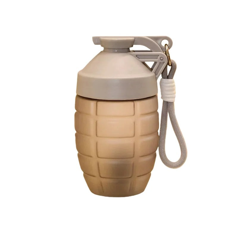 Grenade shaped water bottle in tan color with a secure lid and wrist strap for outdoor activities