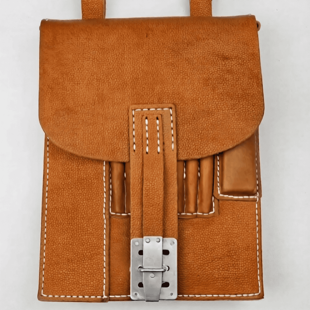 Brown leather map case replica with secure buckle and storage pockets
