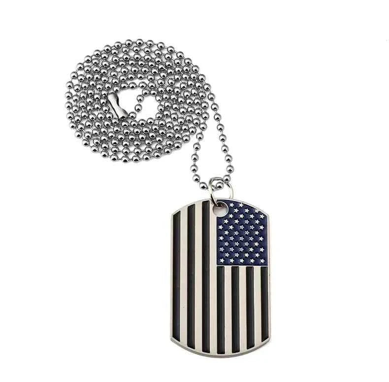 Military style flag pendant on a stainless steel ball chain necklace featuring an American flag design