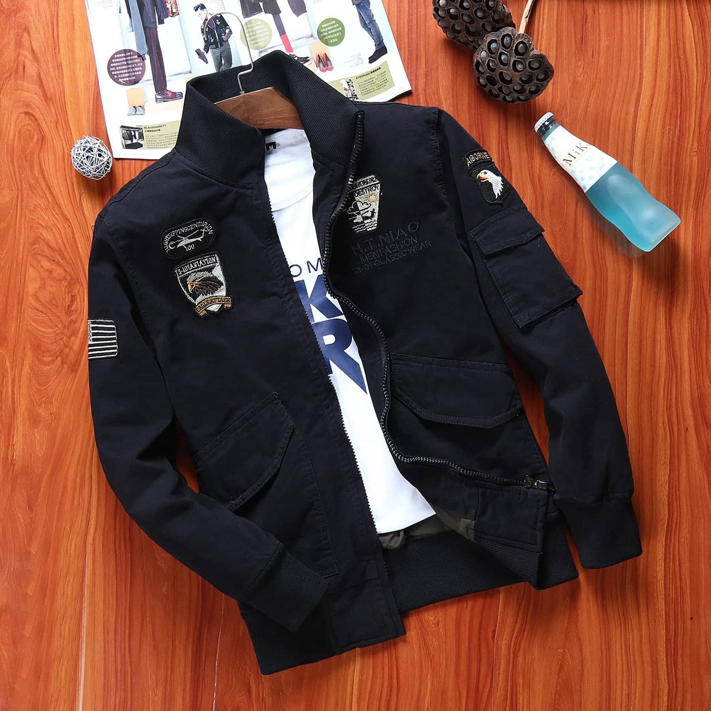 Men's outdoor flight jacket in black with military patches and multiple pockets for adventure enthusiasts