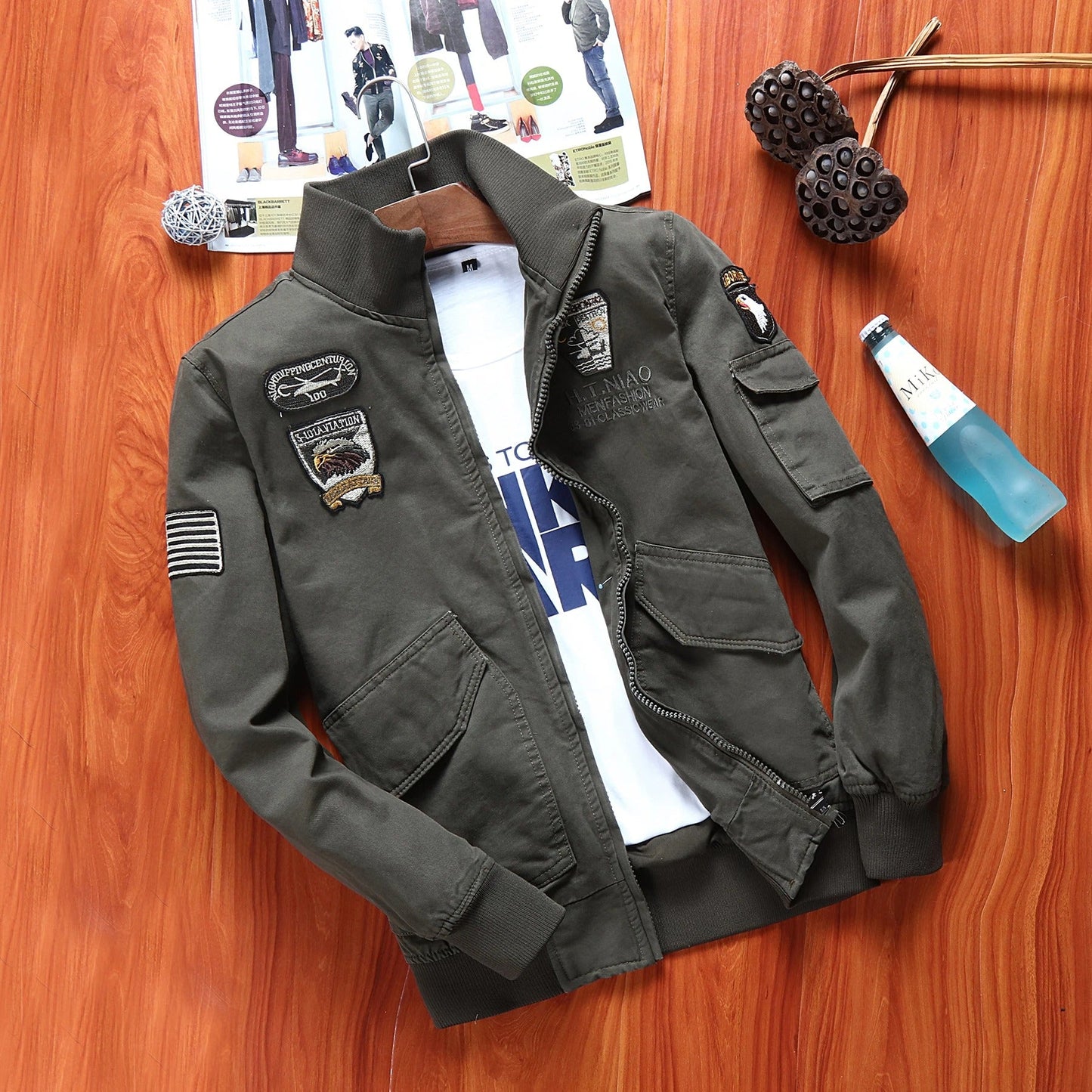 Men's outdoor flight jacket featuring military patches and a stylish design for outdoor adventures