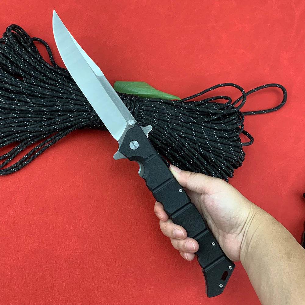 Robust professional survival knife with a stainless steel blade and a textured grip for outdoor adventures
