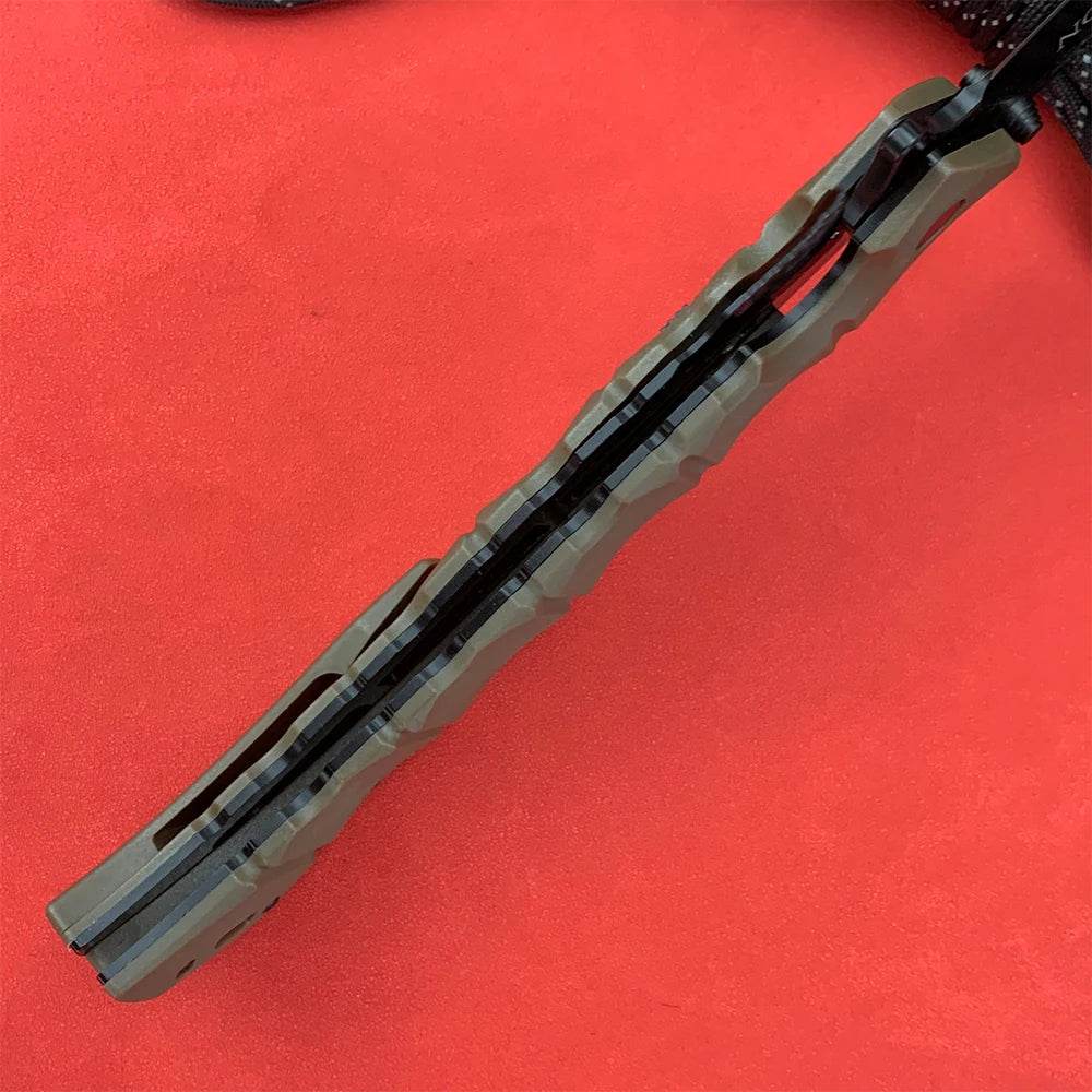Side view of a professional survival knife with textured black handle for a secure grip
