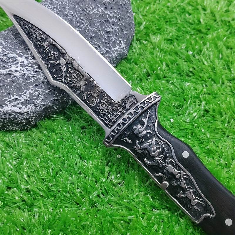Intricately designed stainless steel hunting knife with a black handle and engraved details