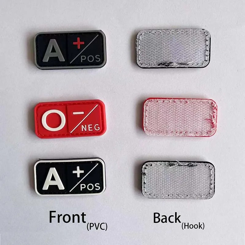 Collection of medical-themed patches with text and symbols on a light gray background.