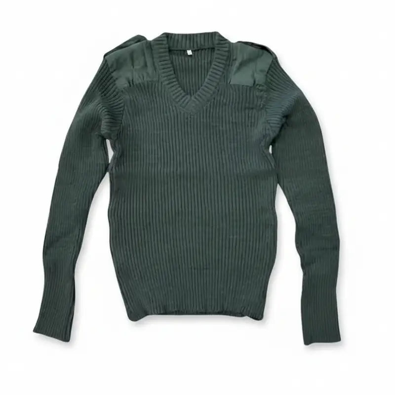 Green ribbed sweater on a white background