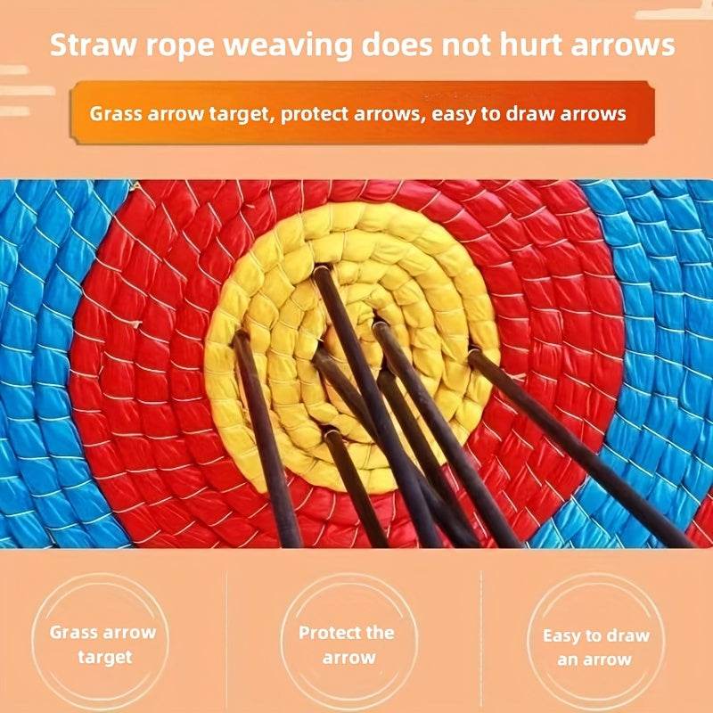 Woven grass archery target showing vibrant red and yellow colors with multiple arrows embedded
