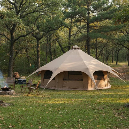 Tan bell tent with stove jack for cozy camping experiences