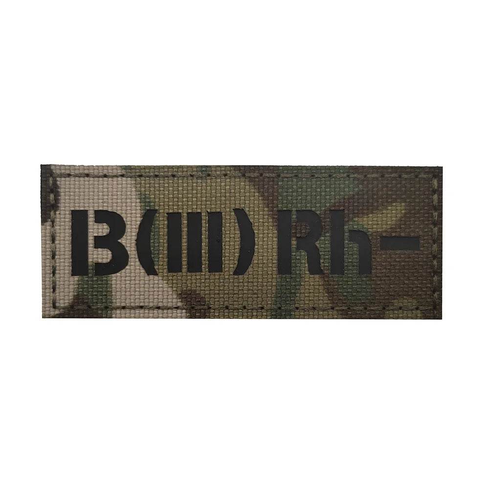 Military blood group patch in camouflage with type and Rh factor.