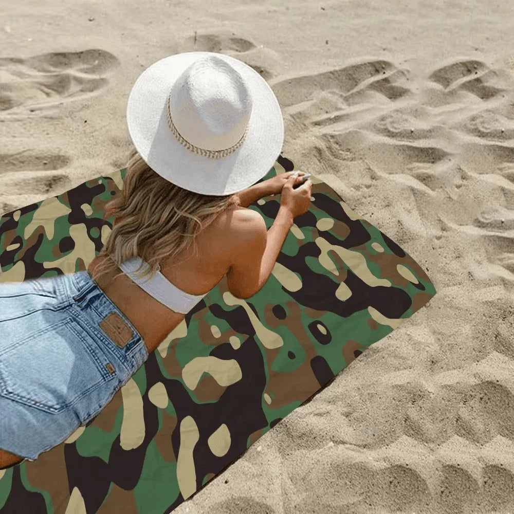 Camouflage beach towel for outdoor use on sandy beaches