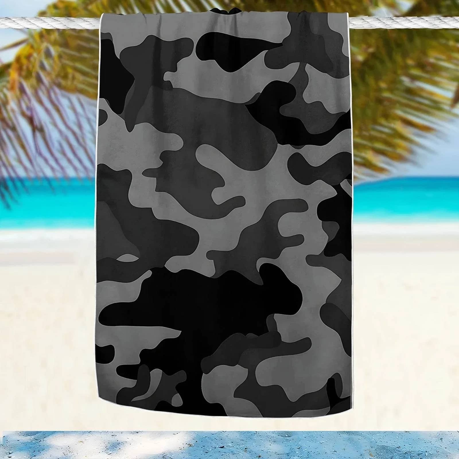 Camouflage beach towel in gray tones, perfect for outdoor use at the beach or pool