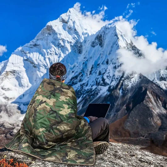 Camouflage camping blanket for outdoor adventures in rugged terrain