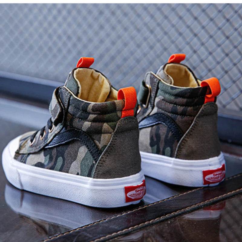 Camouflage high-top sneakers in green with orange accents for kids