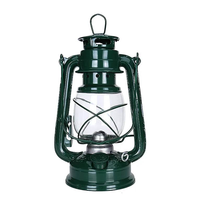 Green retro kerosene lamp with a glass globe, perfect for camping and outdoor activities