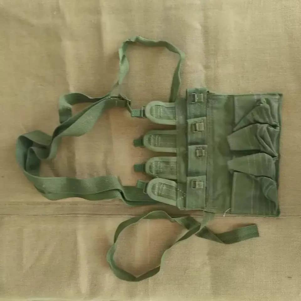 Chinese canvas pouch in green with multiple pockets for carrying gear