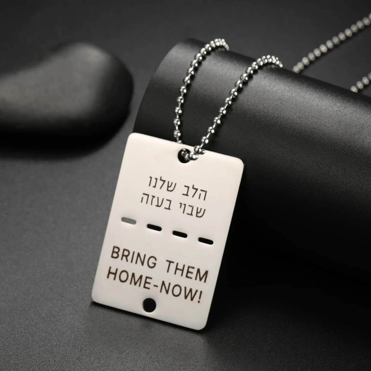 Customizable dog tag necklace with engraved message and silver chain for military tribute