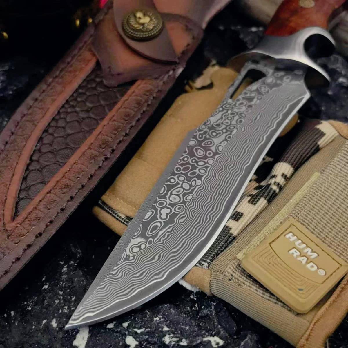 Damascus handmade knife with intricate blade design and wooden handle for outdoor use