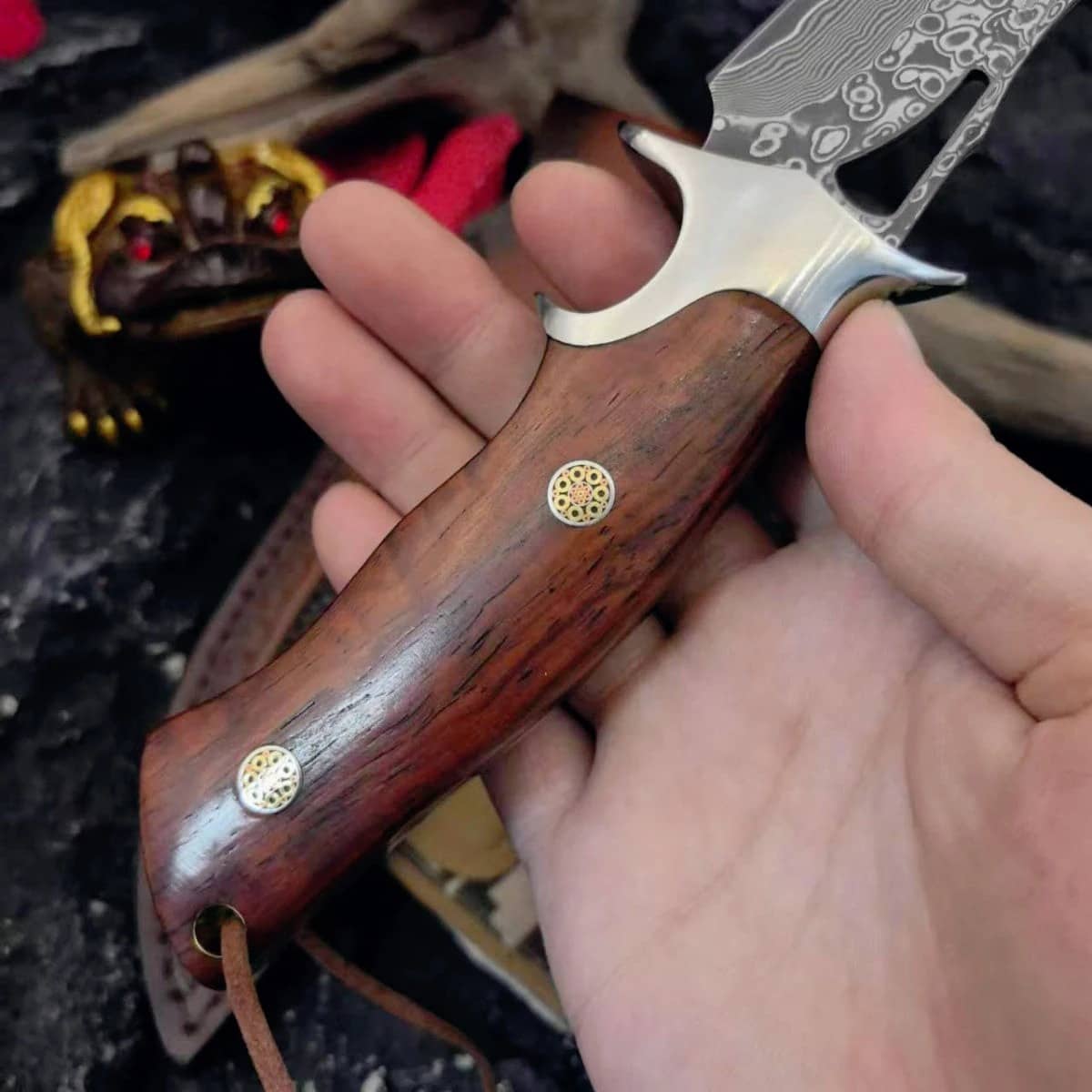 Damascus handmade knife with a polished wooden handle for precision cutting
