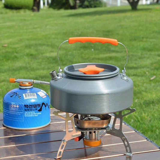 Outdoor camping kettle with orange handle for brewing coffee outdoors