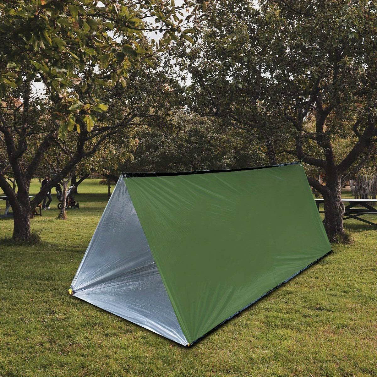 2-person emergency shelter tent in green set up in a grassy area among trees
