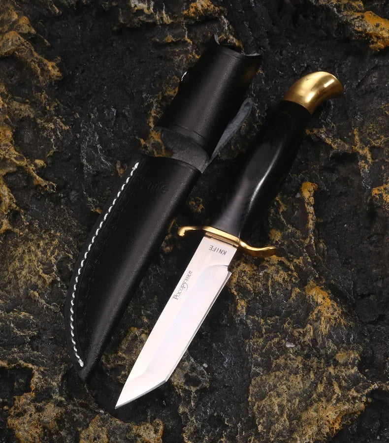 Finka NKVD knife with black handle and brass guard for outdoor use