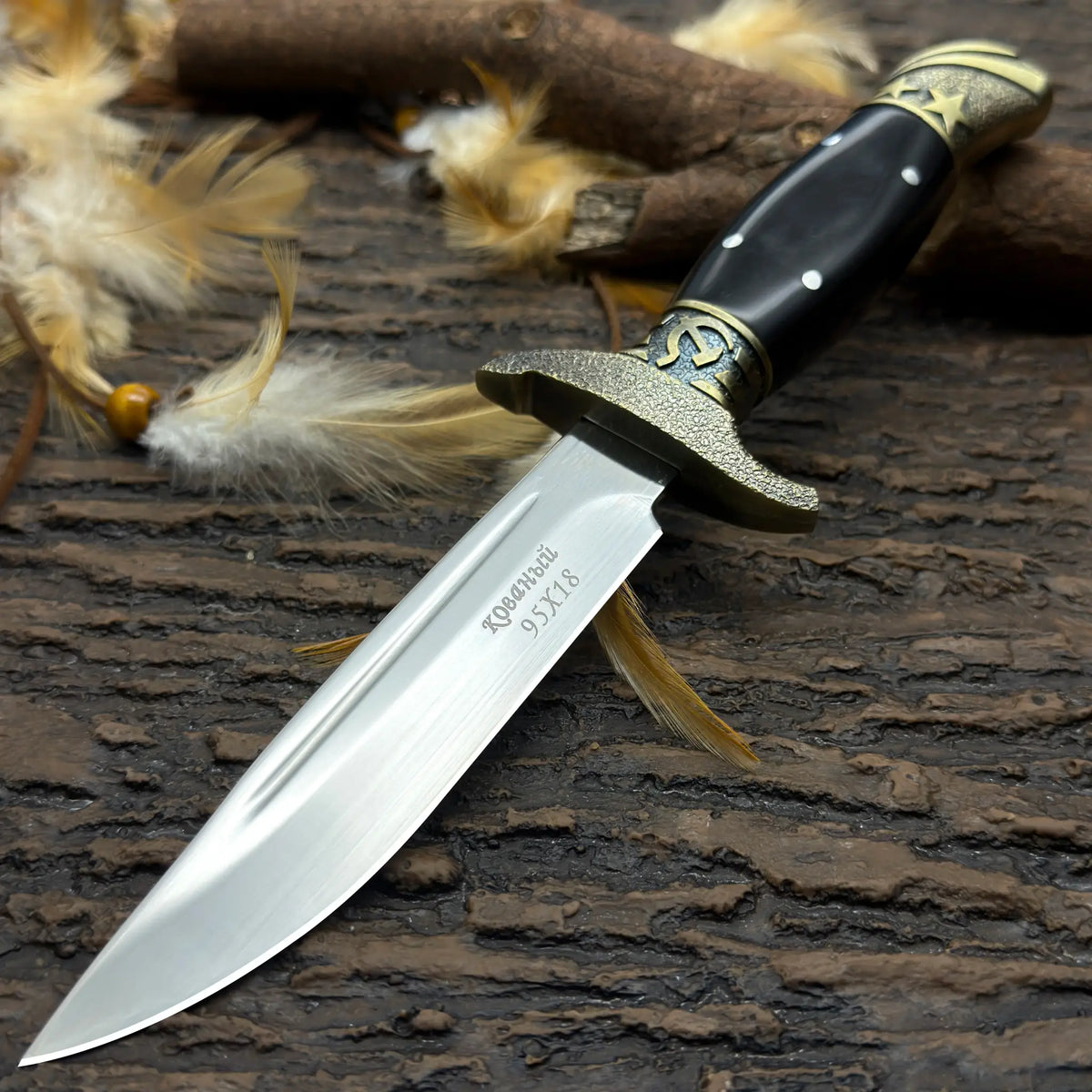 Finka NKVD knife with a polished blade and ornate handle for outdoor use