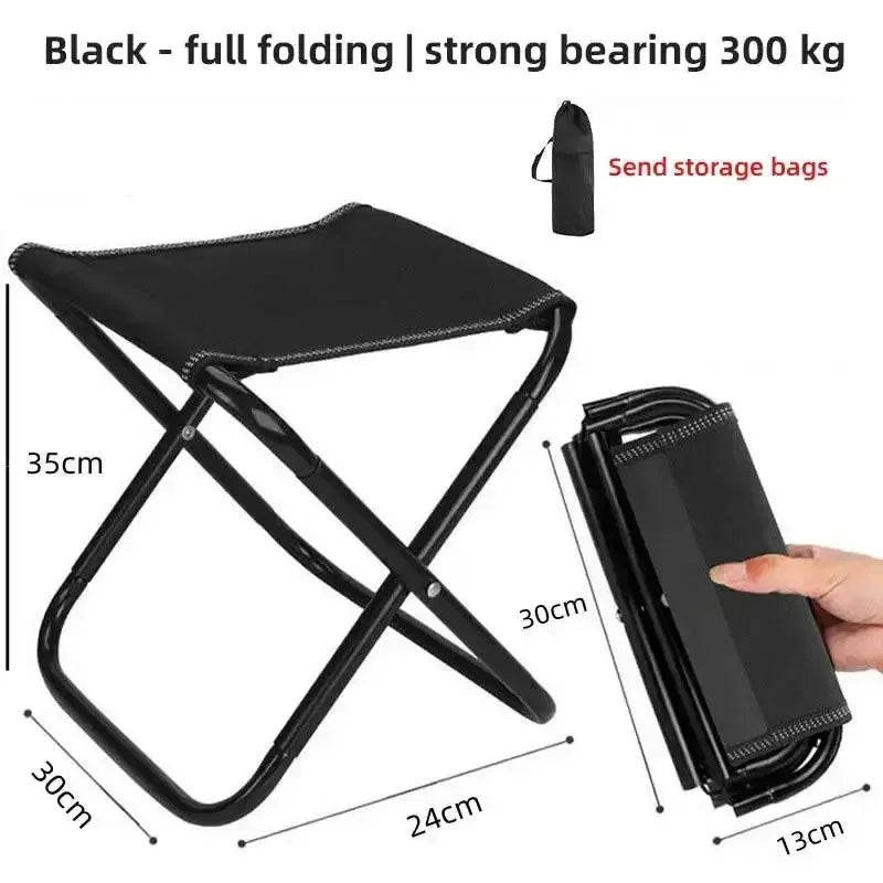 Black folding camping chair with strong 300 kg weight capacity and storage bag