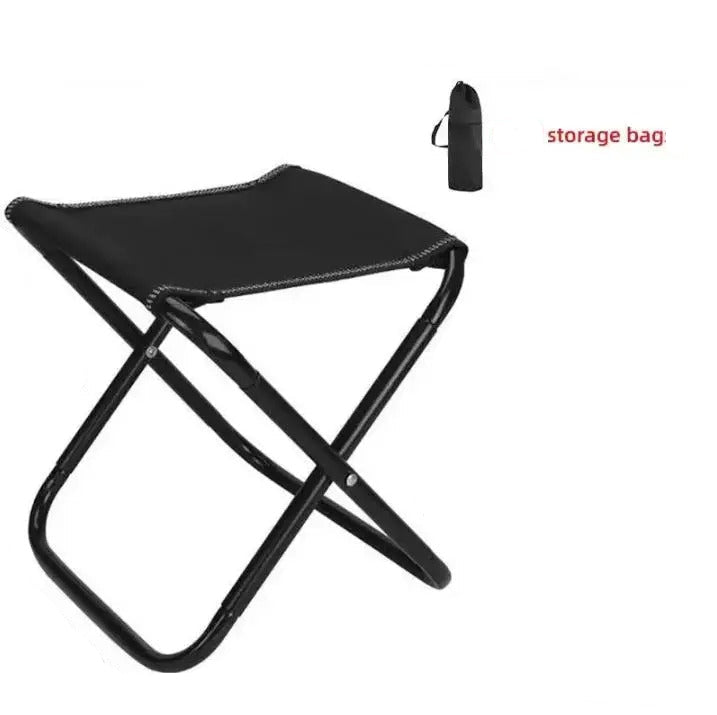 Black folding camping chair with storage bag for easy transport
