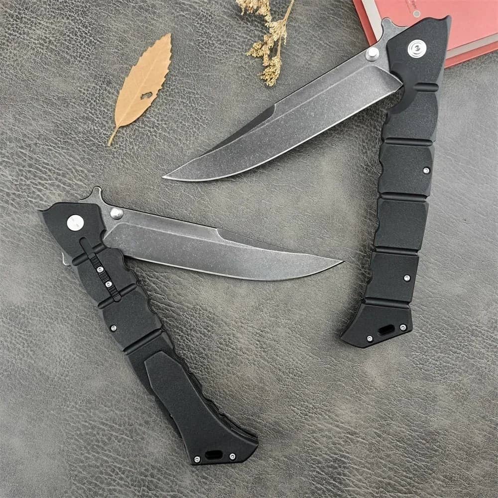 Black folding utility knife with ergonomic handle for practical use
