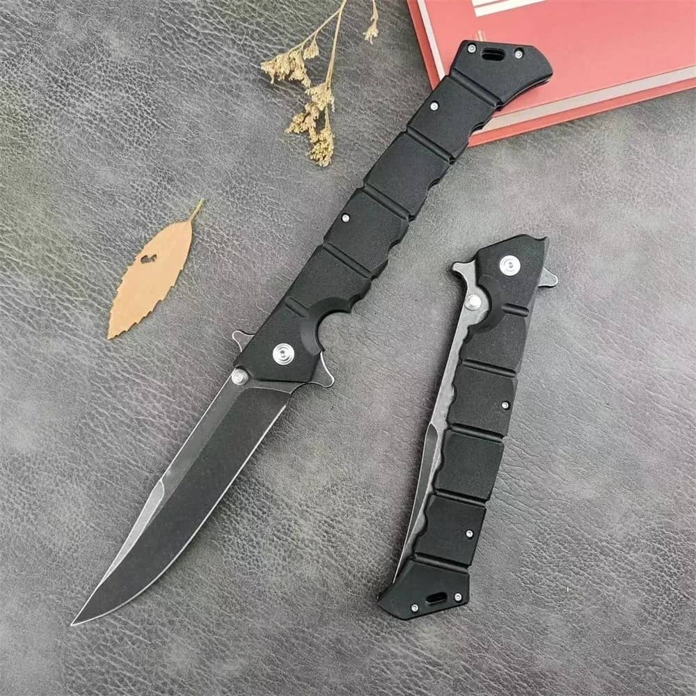 Black folding utility knife with ergonomic grip for versatile cutting tasks