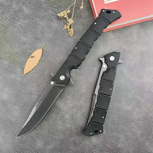 Black folding utility knife with ergonomic grip for versatile cutting tasks
