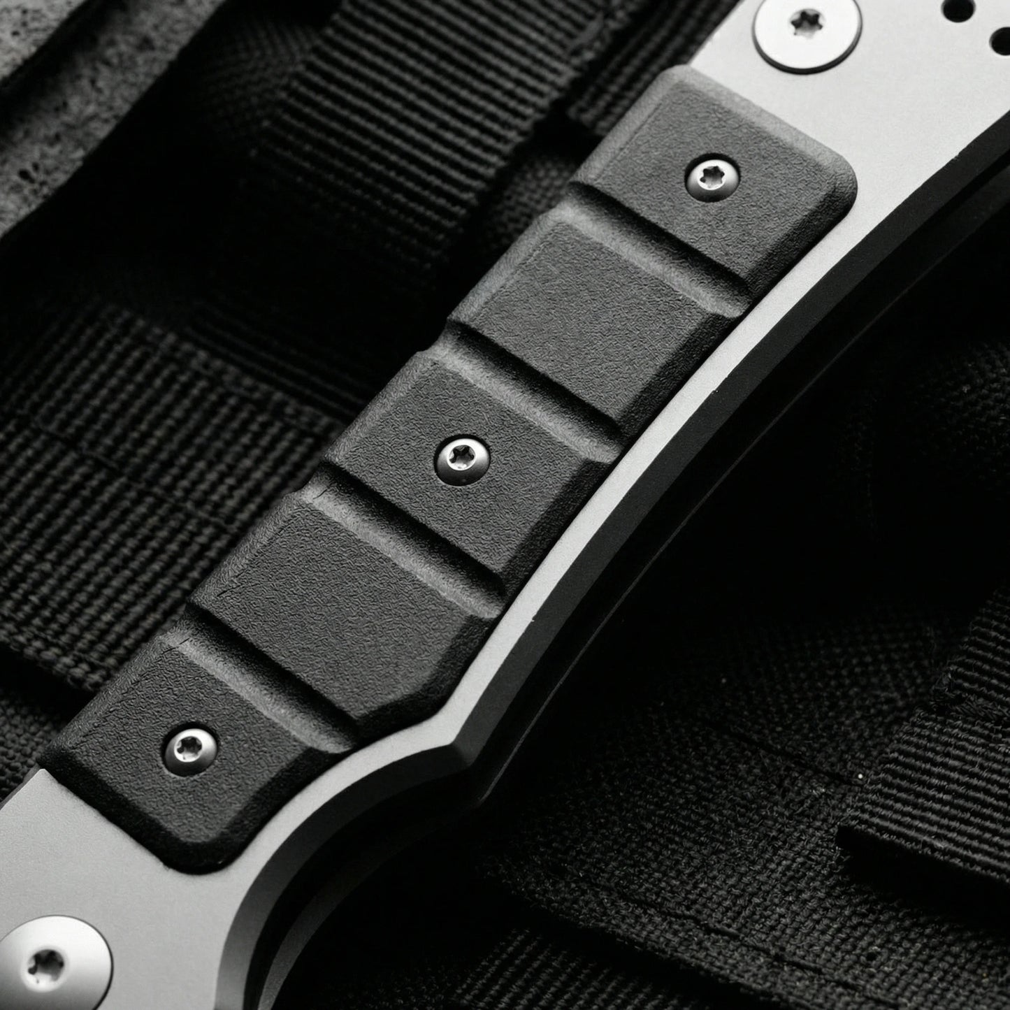 Folding utility knife with textured grip for secure handling