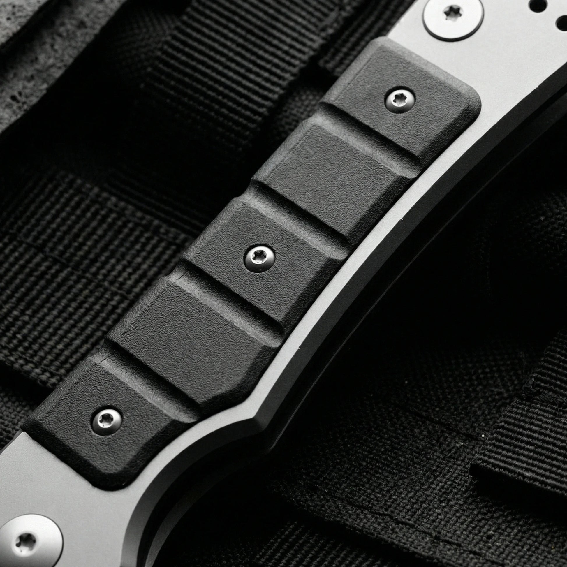 Folding utility knife with textured grip for secure handling