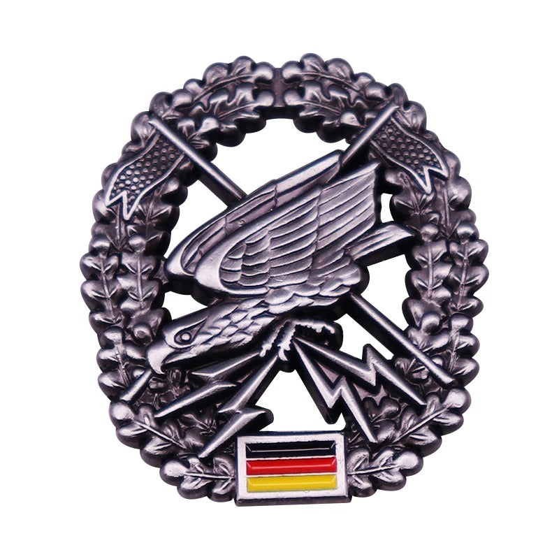 German badge replica in silver with eagle and crossed swords design