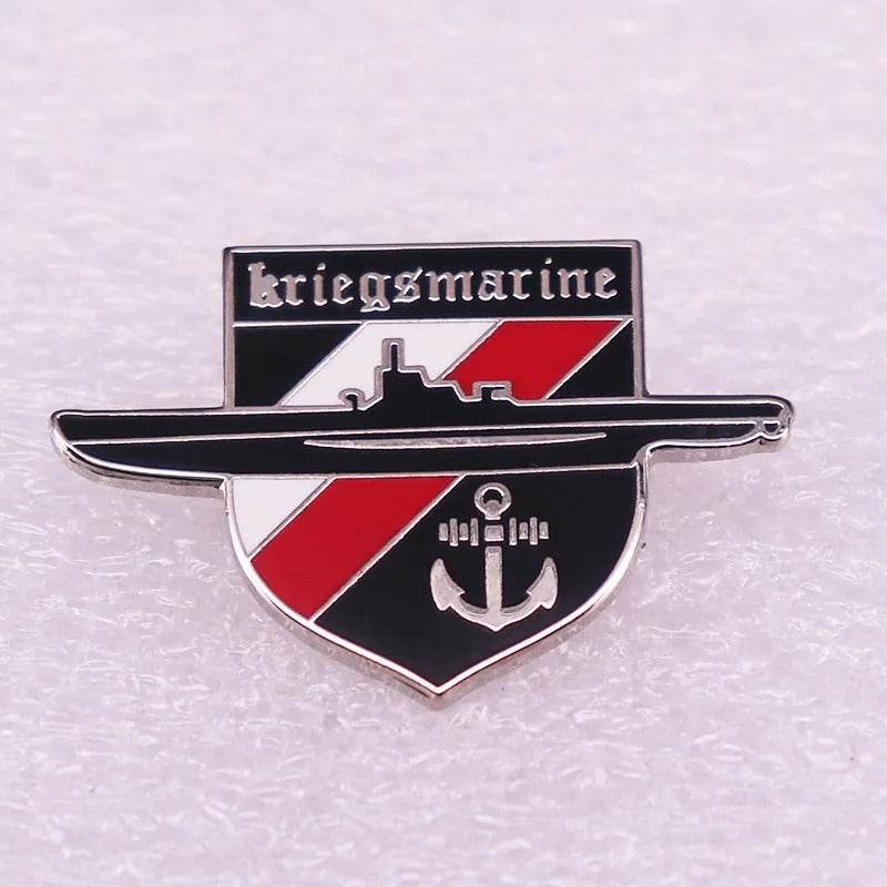 German badge replicas featuring a Kriegsmarine submarine design in red and black