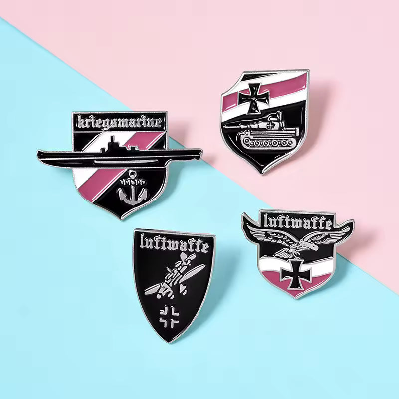Set of four German badge replicas featuring military insignia and unique designs