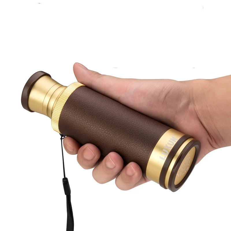 High-powered monocular telescope in hand with a leather grip for outdoor adventures