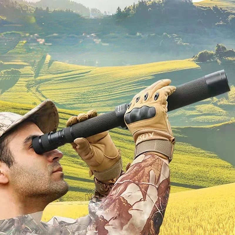 High-powered monocular telescope being used by a man in a wooded landscape for outdoor observation