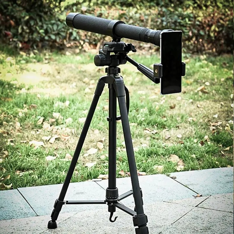 High-powered monocular telescope mounted on a tripod with a smartphone holder for easy viewing