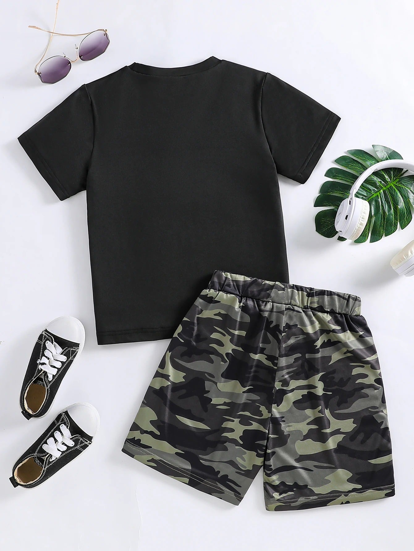 Kids camouflage clothing set featuring a black t-shirt and camo shorts for outdoor play