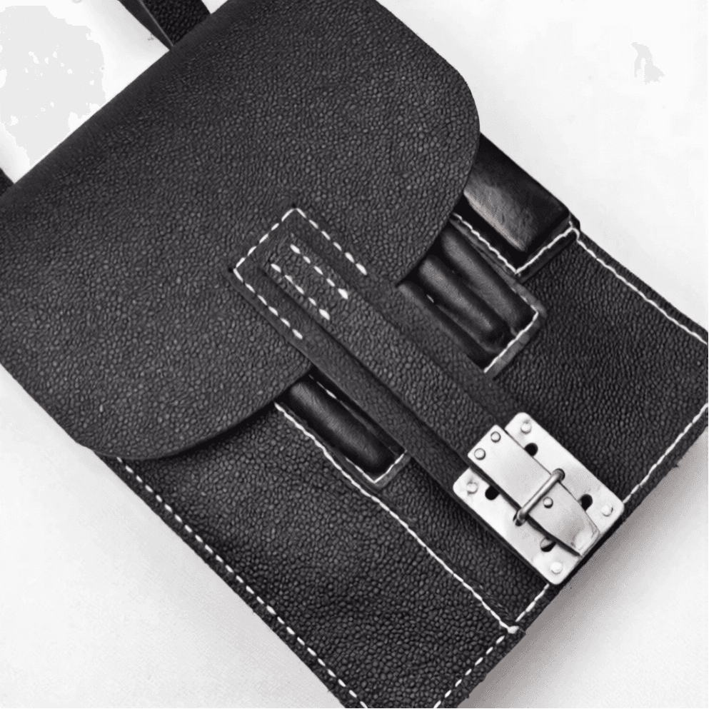 Black map case replica with metal clasp for secure storage