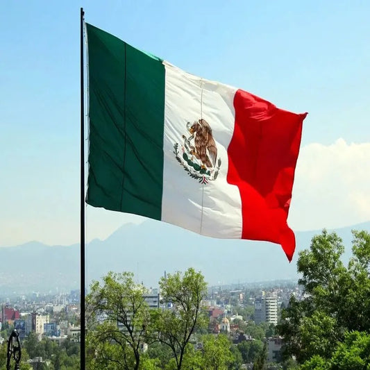 Mexico national flag flying high with green, white, and red colors
