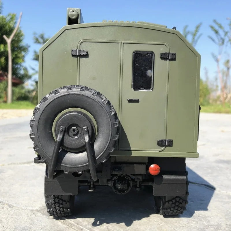 Rear view of a military RC truck with detailed spare tire and realistic design for outdoor enthusiasts