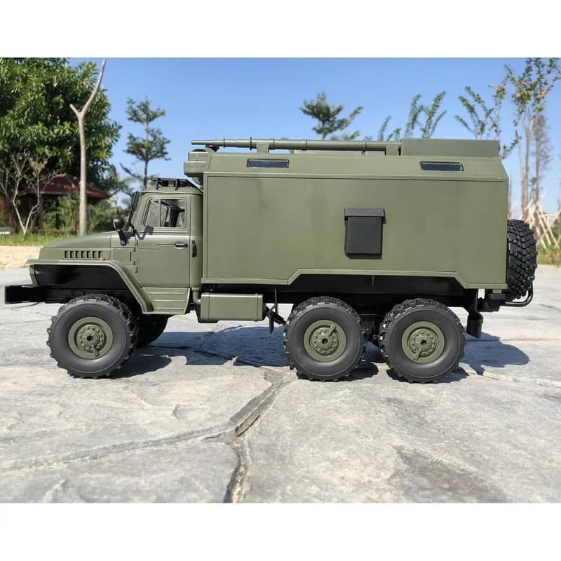 Military RC truck in green color with detailed design and heavy-duty wheels for outdoor adventures