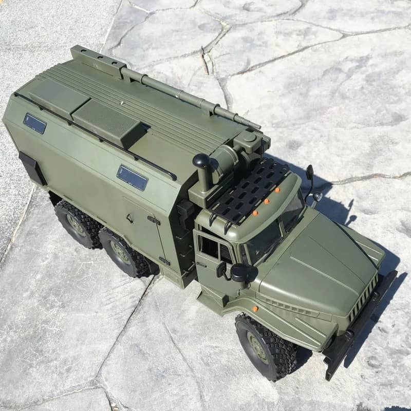 Military RC truck in olive green with detailed design and rugged tires for outdoor adventures