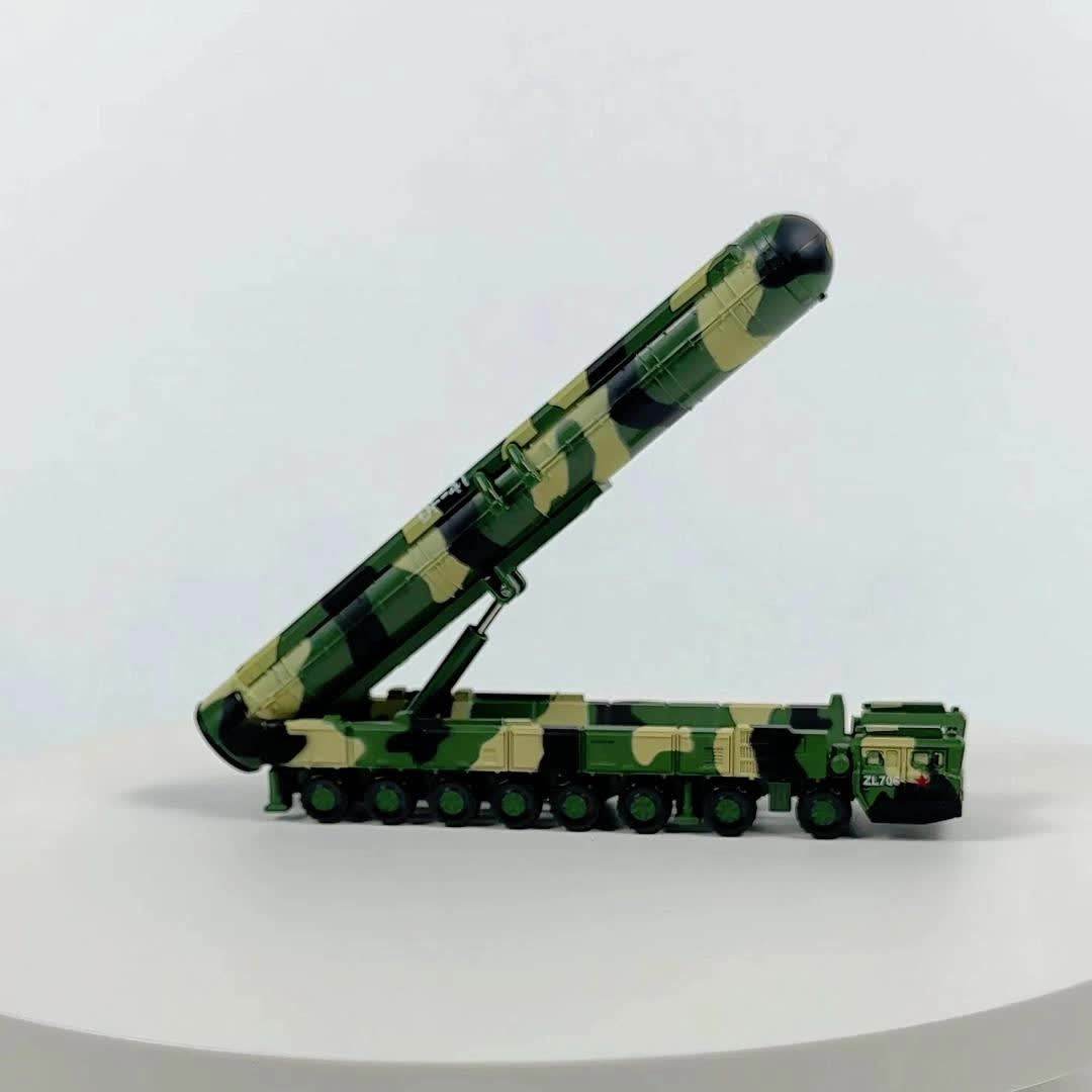 Detailed missile transport truck model in camo design with raised missile for military collectors