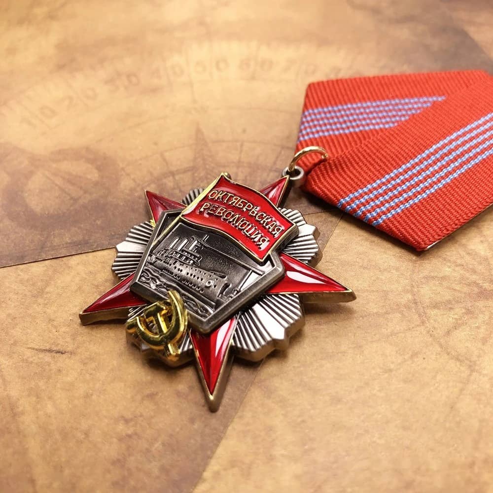 Order of the October Revolution replica medal with red ribbon and detailed emblem