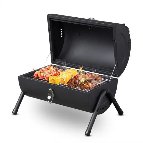 Portable black outdoor charcoal grill with charcoal, perfect for barbecues